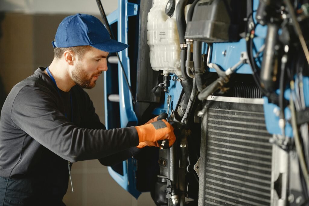 Mechanic repairing a machine with precision, showcasing industrial expertise.